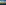 Die Skyline einer Stadt mit aufsteigendem Qualm aus Schornsteinen. Der Qualm zeichnet den Schriftzug CO2 in den Himmel.